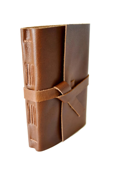 Front angled view of golden brown genuine leather sketchbook