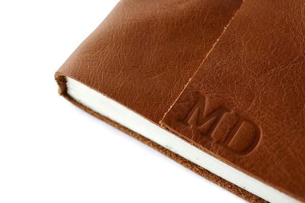 Example of stamped personalized initials on Golden Brown leather journal cover