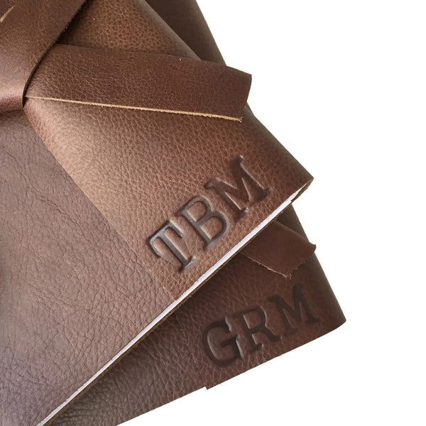 Example of stamped personalized initials on Chocolate leather journal covers