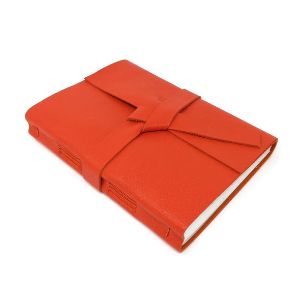 Top angled view of orange leather sketchbook