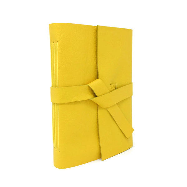 Angled front view of yellow leather journal notebook