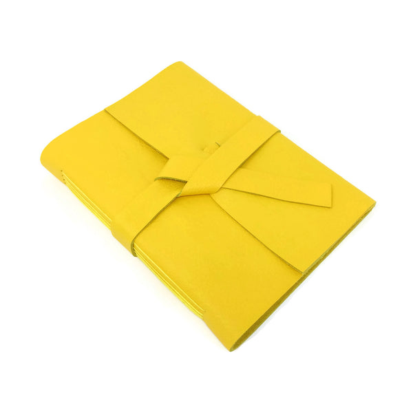 Top view of yellow leather journal notebook