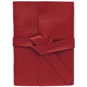Front view of deep red leather journal with wrap cover