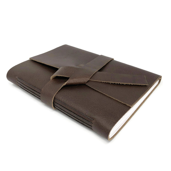 Top angled view of slim leather journal notebook in chocolate brown