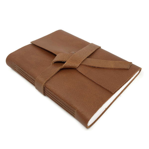 Top Angled view of golden brown slim leather notebook