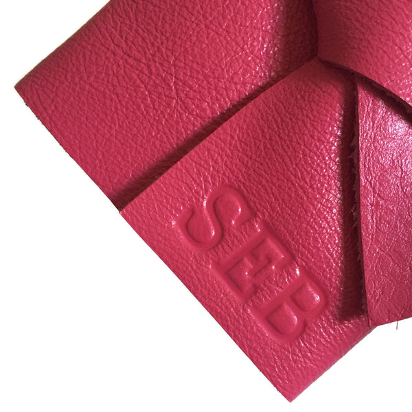 Example of stamped personalized initials on pink leather journal cover